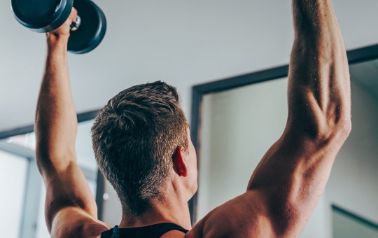 man working out vitamin packs