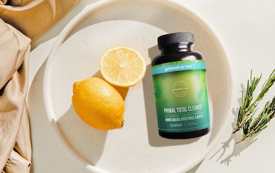 Sliced lemon next to primal total cleanse