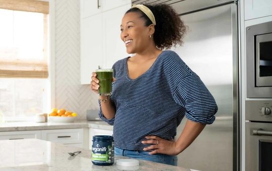 Organifi greens on a kitchen counter.